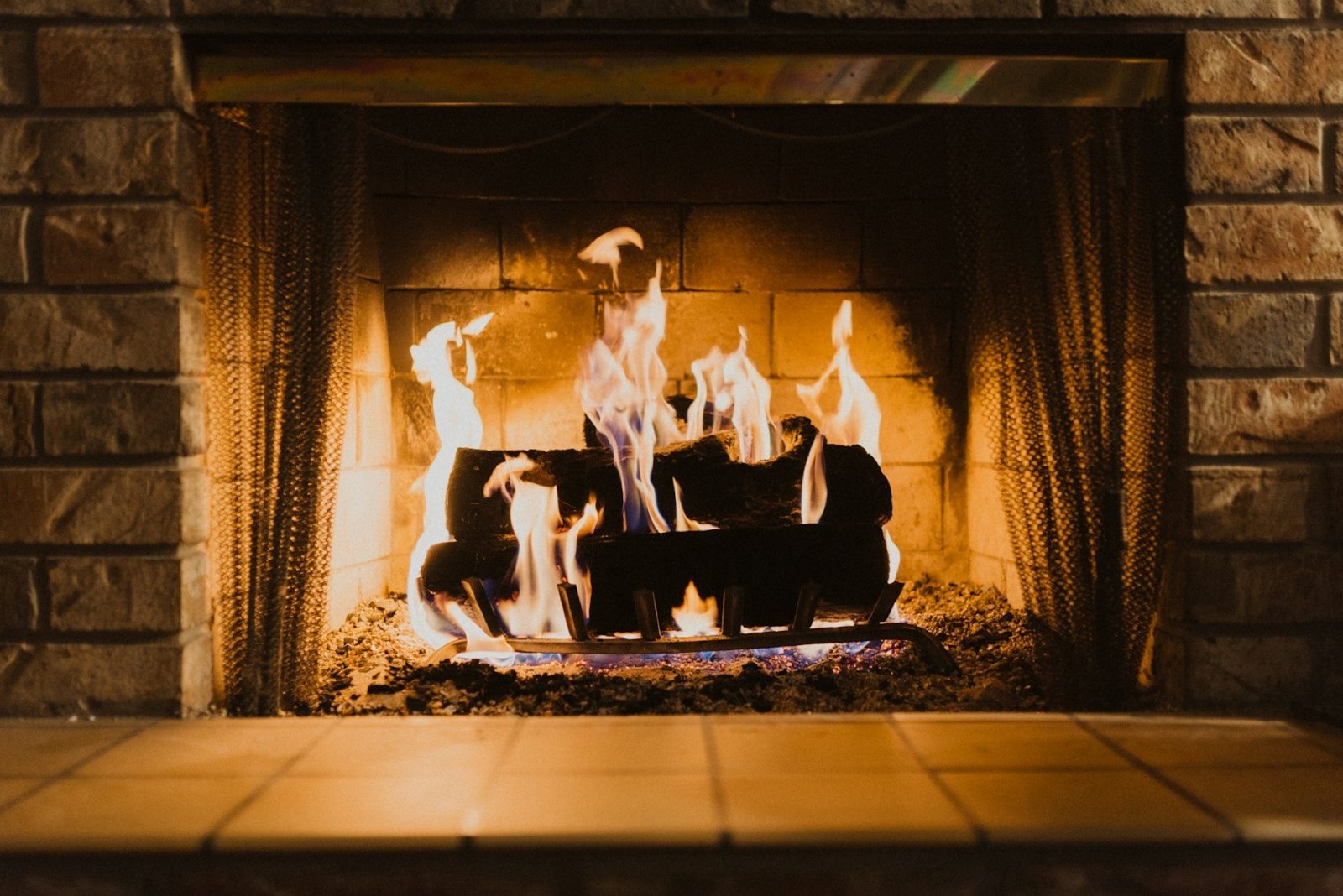 Stone fireplace and hearth mid-restoration