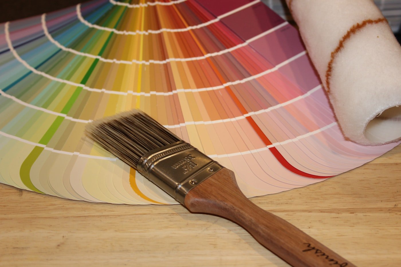 Color consultation with a brush and paint swatch fan